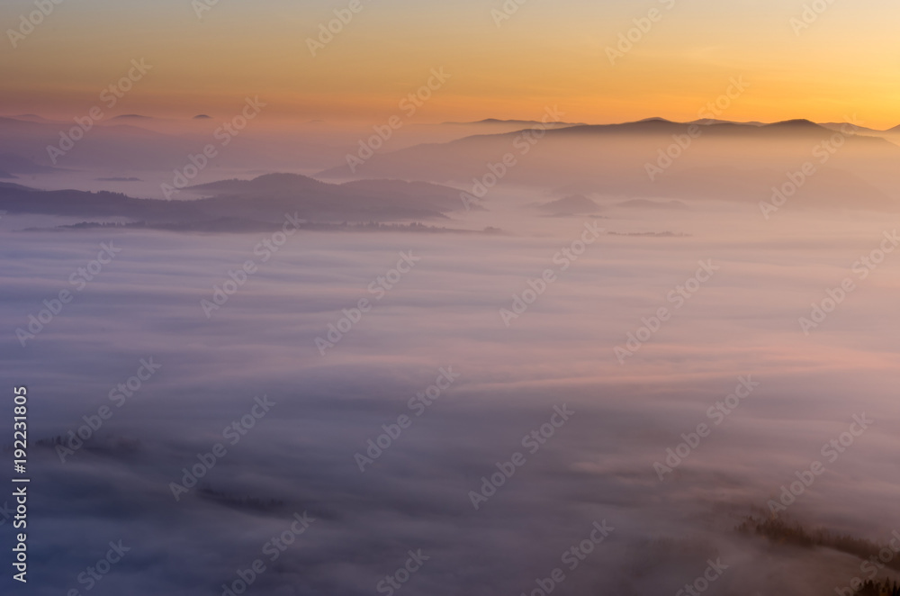 A fascinating landscape. Sunrise over the clouds.