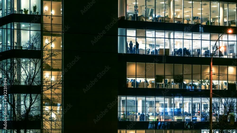 Office work at night in modern skyscraper with a lot of people. Time lapse Office work at night in modern skyscraper with a lot of people. Time lapse