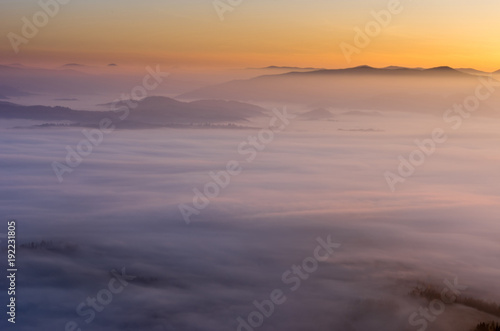 A fascinating landscape. Sunrise over the clouds. © vzwer