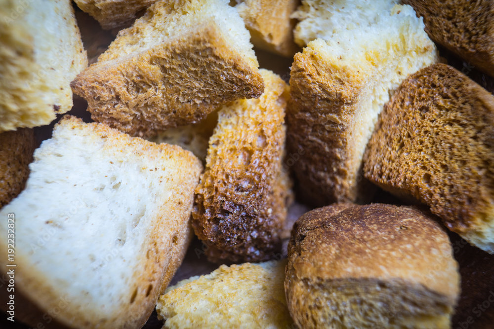 Fried croutons of white bread. A close-up photograph. Fried croutons of white bread. A close-up photograph.