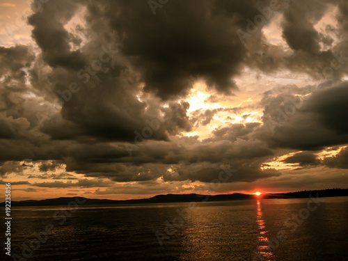 sunset on Sebago lake in Maine photo