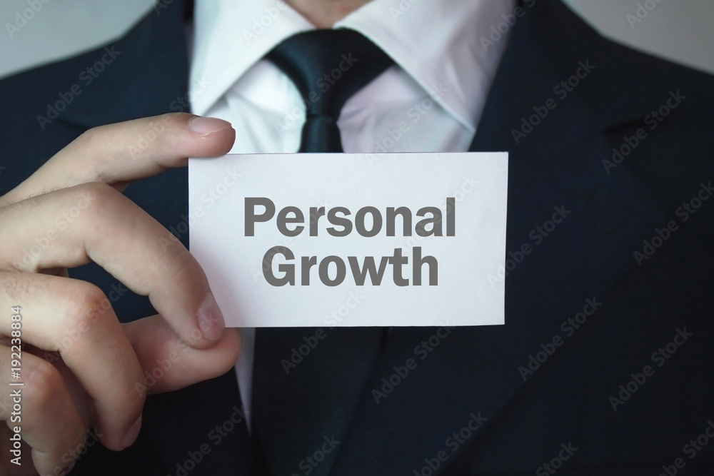 Businessman showing Personal Growth text on business card. Businessman showing Personal Growth text on business card.