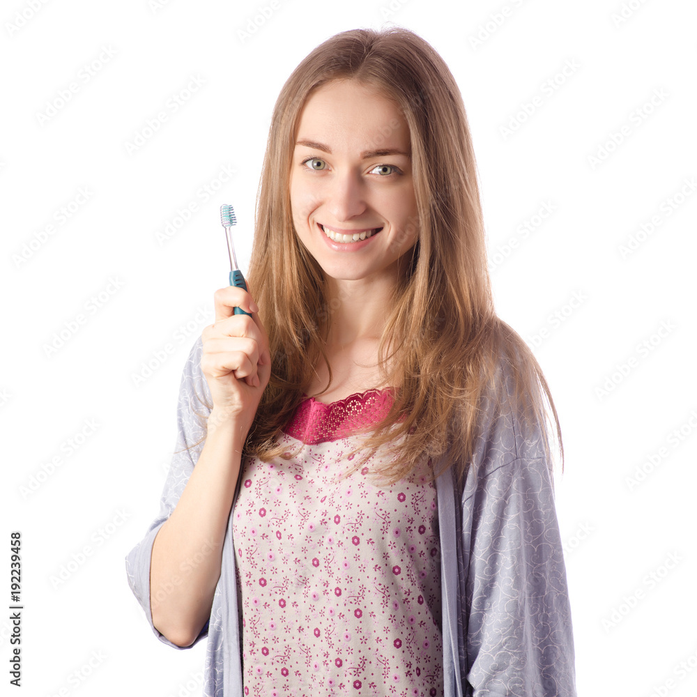 Young beautiful woman in a bathrobe brush for cleaning teeth Young beautiful woman in a bathrobe brush for cleaning teeth