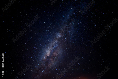 starry night sky with milky way.  image contain soft focus, blur and noise due to long expose and high iso.