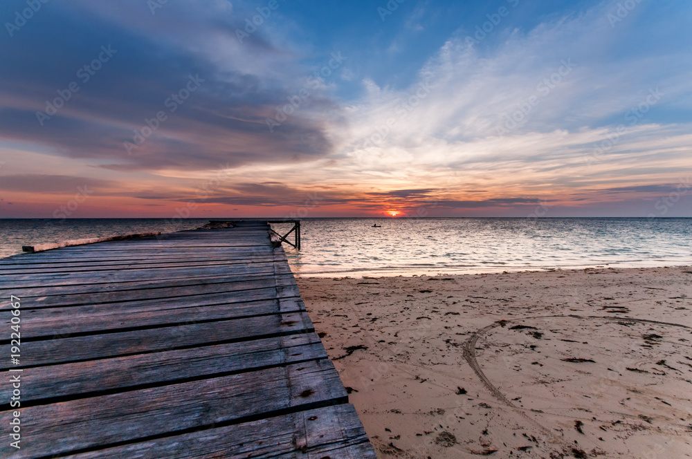 seascape sunset with wooden jetty.