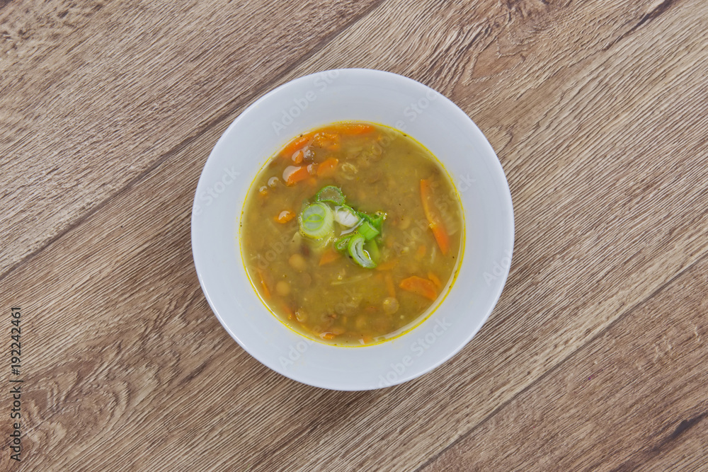 Lentil soup with carrot on a table Lentil soup with carrot on a table
