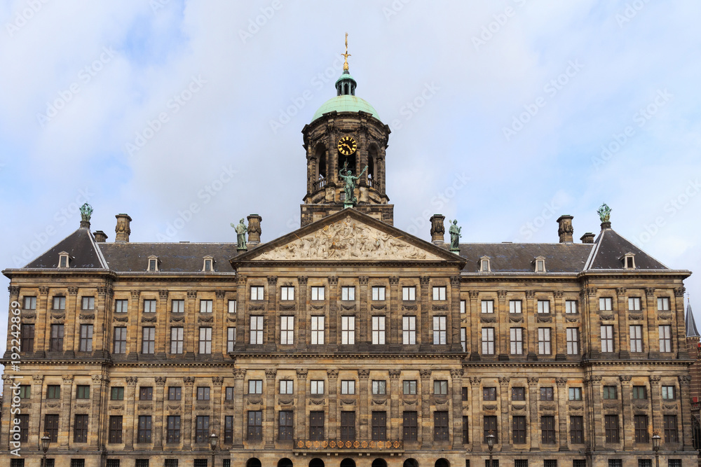 View to the Royal Palace of Amsterdam, Netherlands on the Dam Square. The palace was built as a city hall during the Dutch Golden Age in the 17th century.