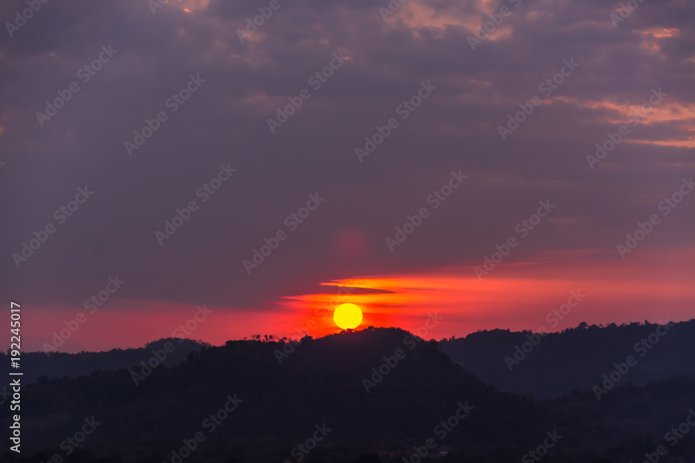 sunset over mountains or hills