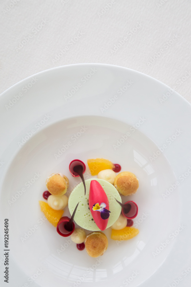 Elegant dessert in the plate, molecular gastronomy, haute couture dessert Elegant dessert in the plate, molecular gastronomy, haute couture dessert
