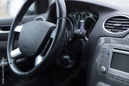Interior of the vehicle speedometer panel and steering wheel with focus on some parts © Daniel Rodriguez