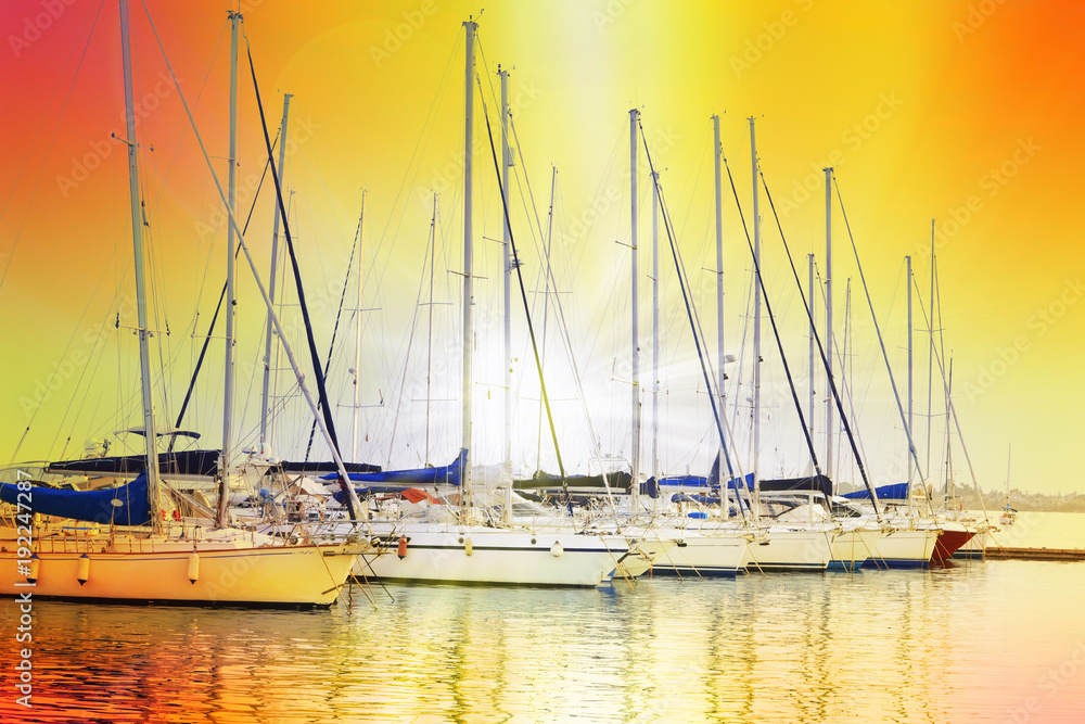 Mooring of sailboats at sunset 