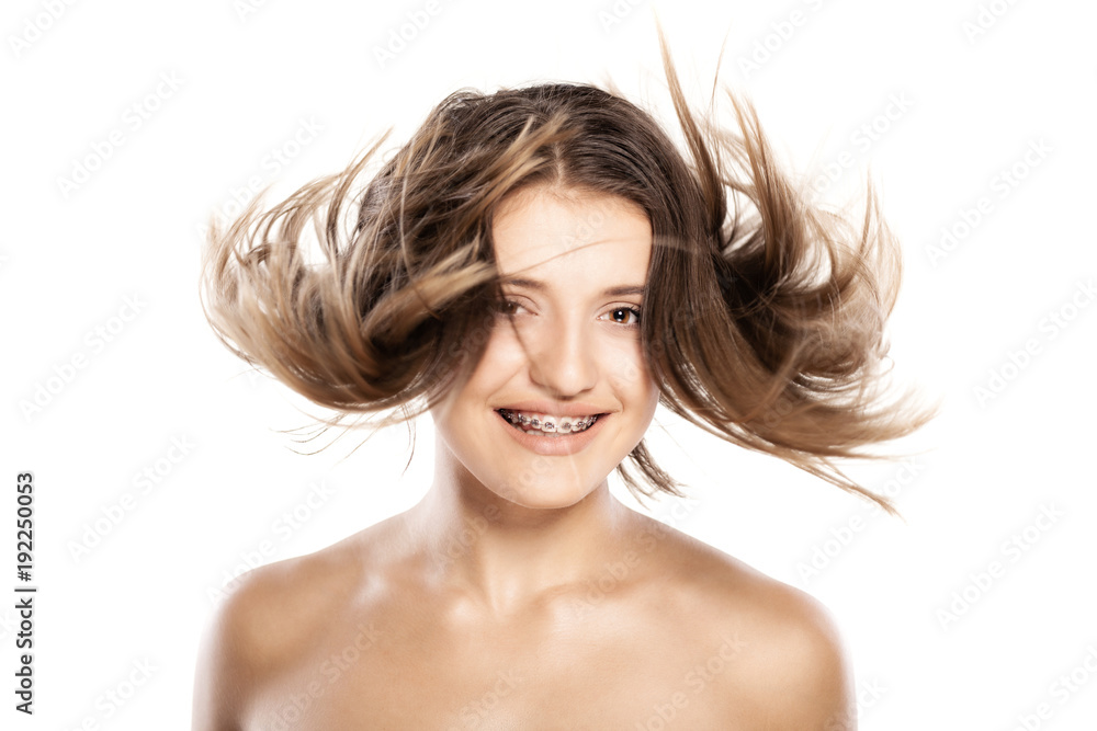 Fototapeta premium attractive young girl withh windy hair