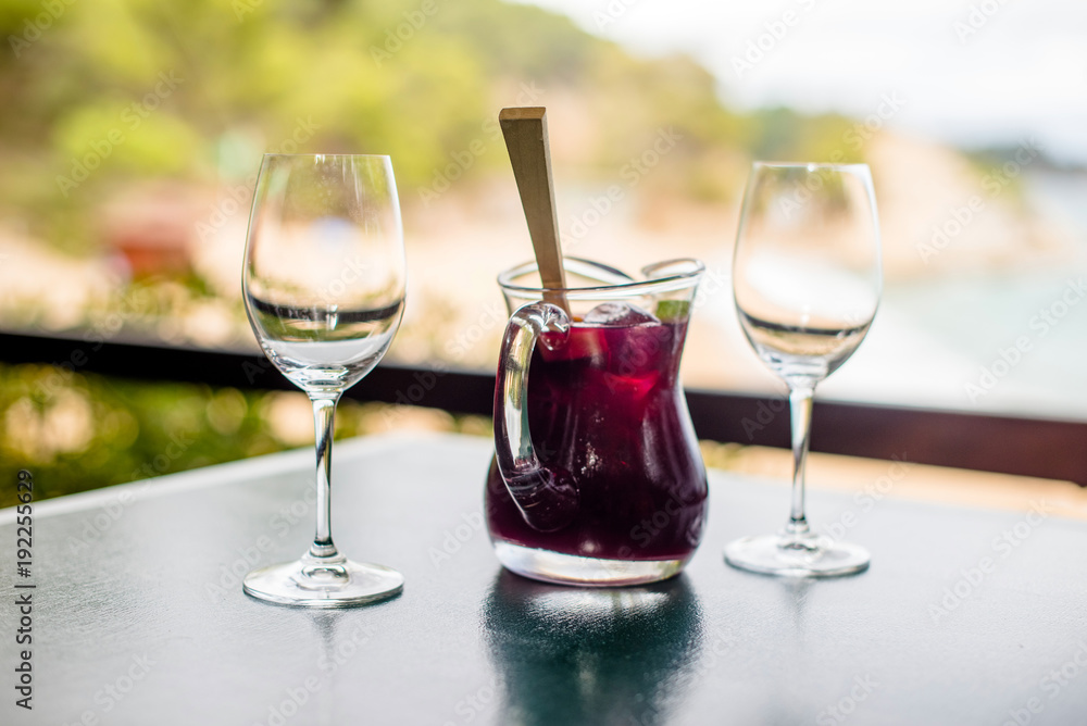 Jug with Sangriya and two glasses on the table Jug with Sangriya and two glasses on the table