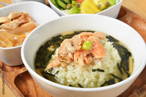 Japanese cuisine,  rice in green tea with salmon  and seaweed 