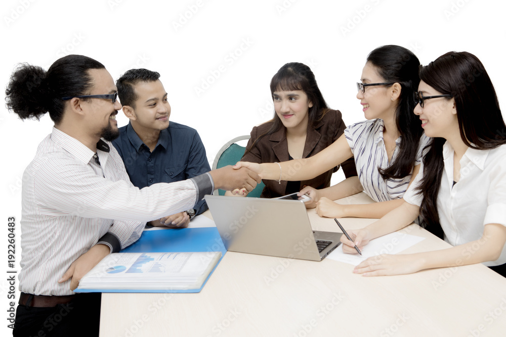 Afro businessman shaking hands with his colleague Afro businessman shaking hands with his colleague