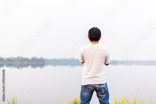 man at the blue lake