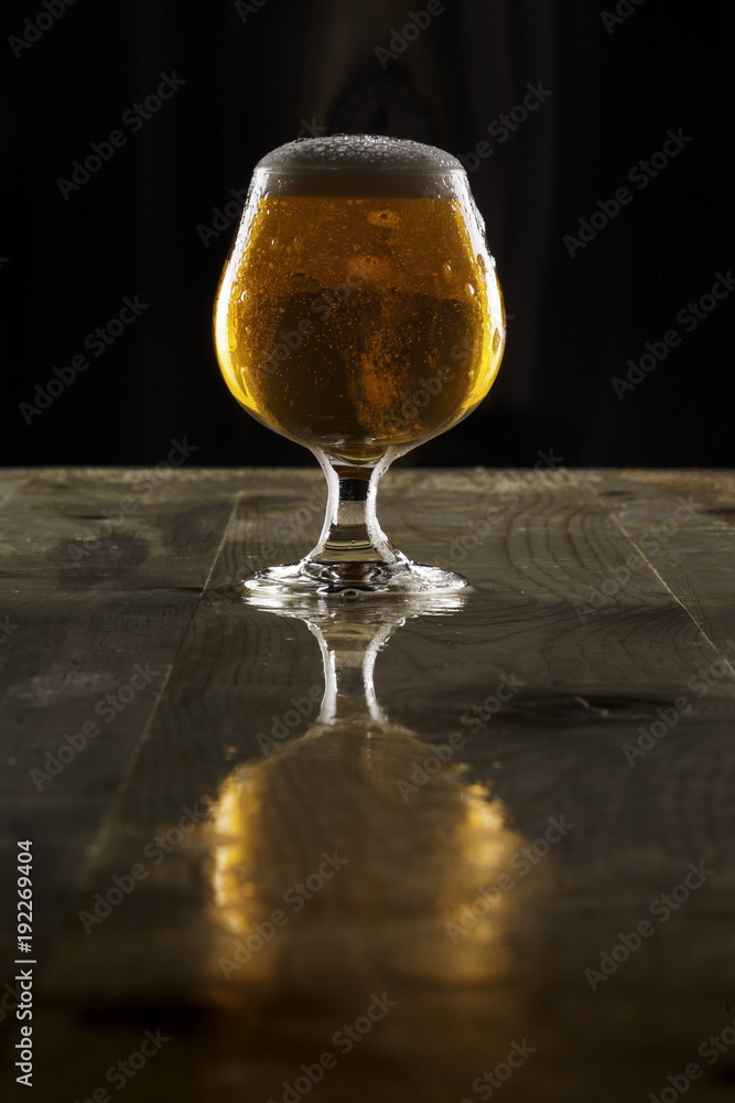 Imperial lager ale in goblet with overflowing head