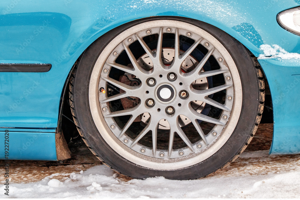 sports car wheel closeup, traces of corrosion