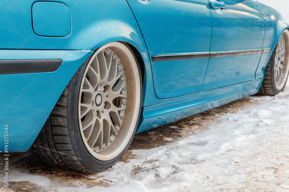 lowered car in winter in the Parking lot