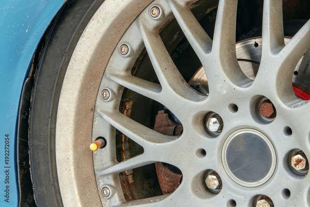 sports car wheel closeup, traces of corrosion