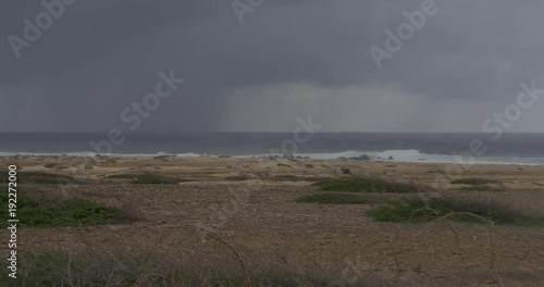 Aruba crashing waves on rocks before a hurricane storm
