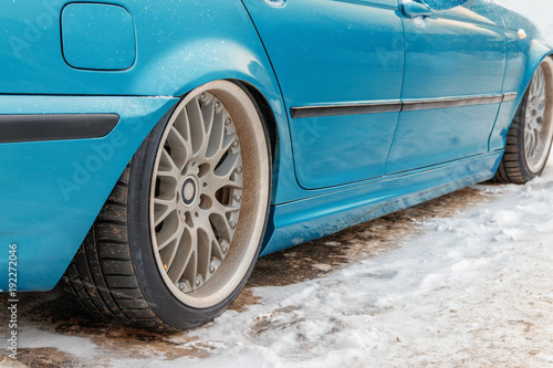 Obraz na płótnie lowered car in winter in the Parking lot w salonie