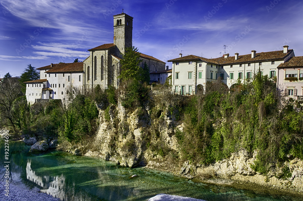 View of borgo Cividale from its bridge. Old Italian small village in northern Italy