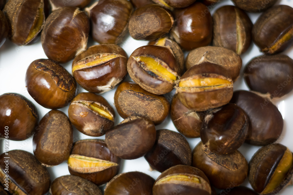 Obraz premium Roasted Chestnuts with white backround