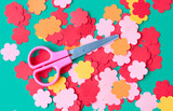 Scissors and paper flowers for applique. Preparation for the spring holiday.