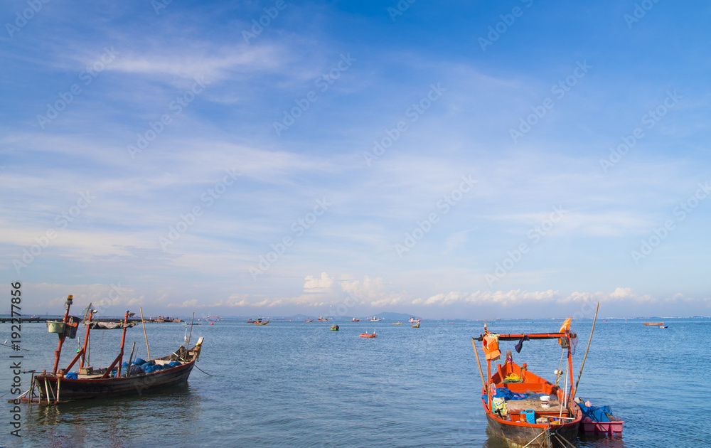 Fishing boat on seascape with daylight background
