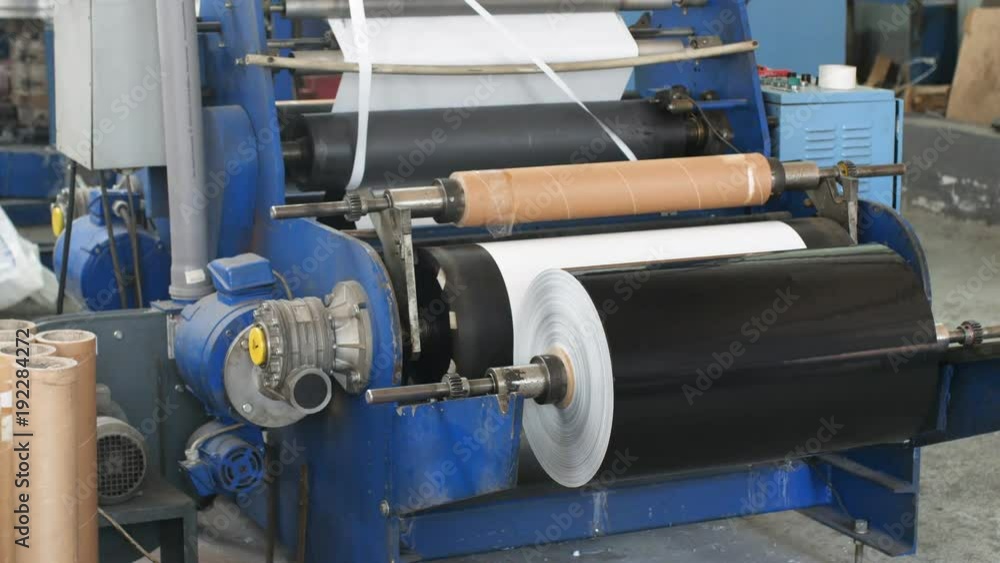 Stack of paper with just now printed material from publishing conveyor Stack of paper with just now printed material from publishing conveyor