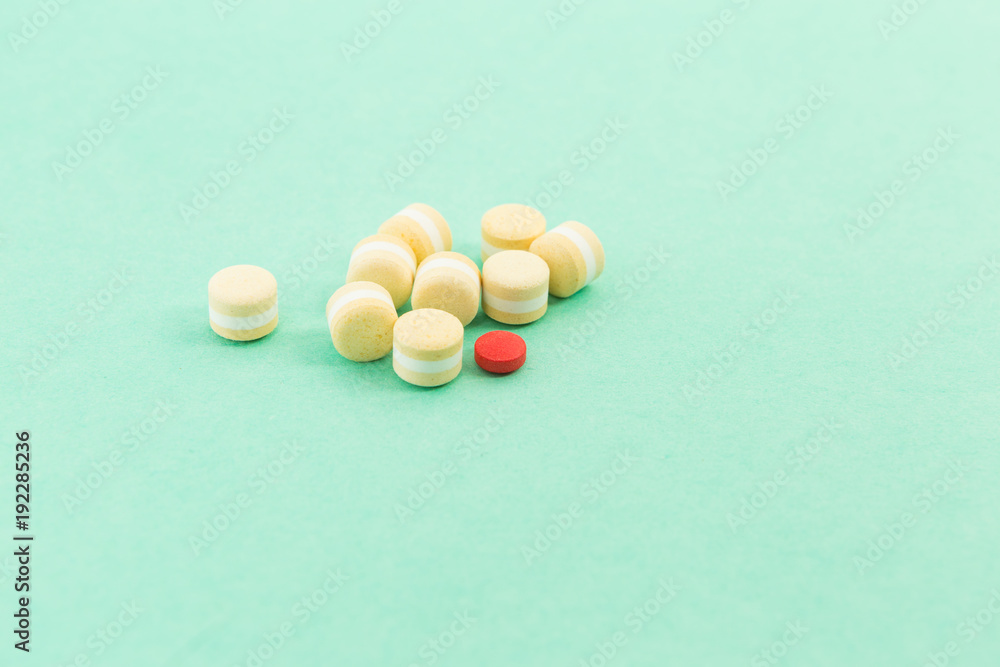 Bunch of pills or tablets and out of pattern concept Bunch of pills or tablets and out of pattern concept