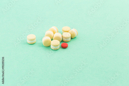 Bunch of pills or tablets and out of pattern concept
