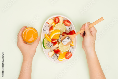 Top view of a man enjoying delicious summer fruits