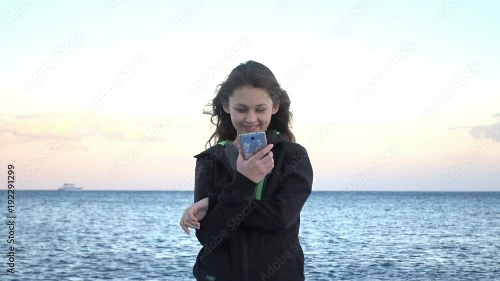 smiling girl on the background of the sea
smiling girl on the background of the sea