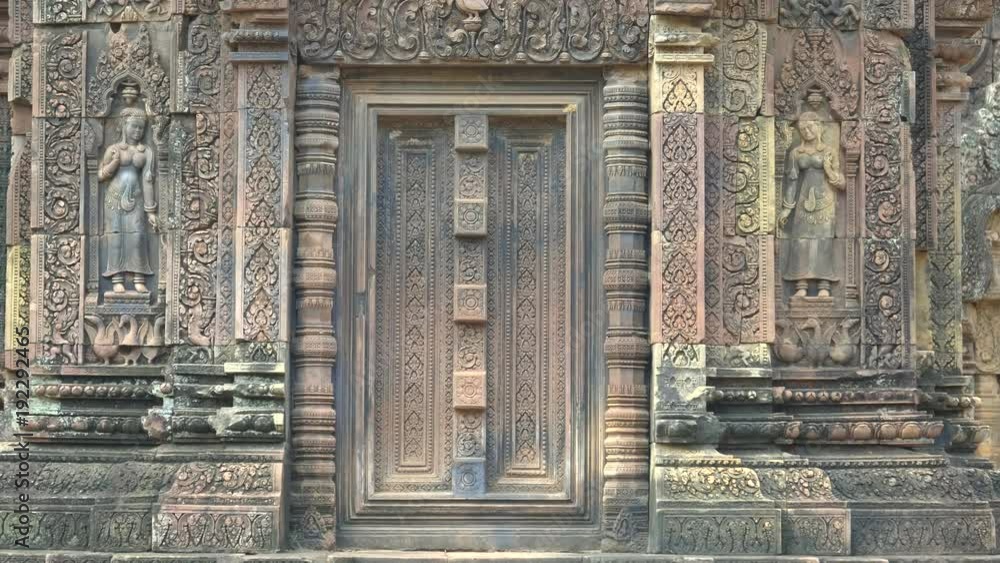 two devata carved in a wall of banteay srei temple at angkor, cambodia two devata carved in a wall of banteay srei temple at angkor, cambodia