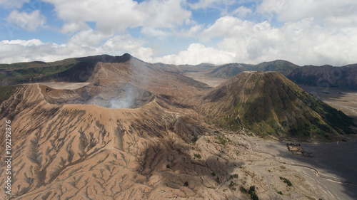 Crater with active volcano smoke in East Jawa, Indonesia. Aerial view of volcano crater Mount Gunung Bromo is an active volcano,Tengger Semeru National Park.