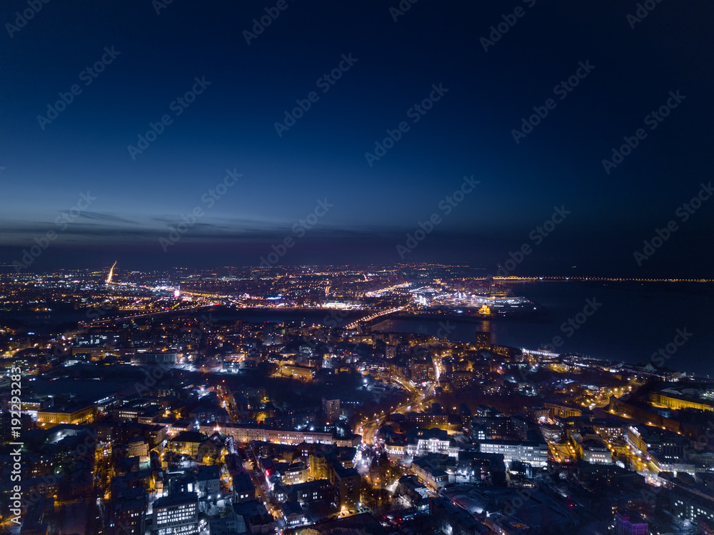 View of the night city in winter from a bird's eye view