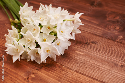 Fototapeta Naklejka Na Ścianę i Meble -  Fresh bouquet of white narcissus flowers on a wooden table