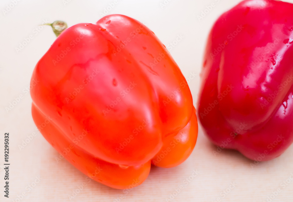 Two red sweet peppers with drops of water. Fresh vegetables for a healthy diet Two red sweet peppers with drops of water. Fresh vegetables for a healthy diet