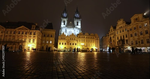 View across the Old Square towards the Church, timelapse, starom the central square of Prague, Prague Castle and Old Town, wide angle, view from the bottom point, Prague, October, 2017 photo