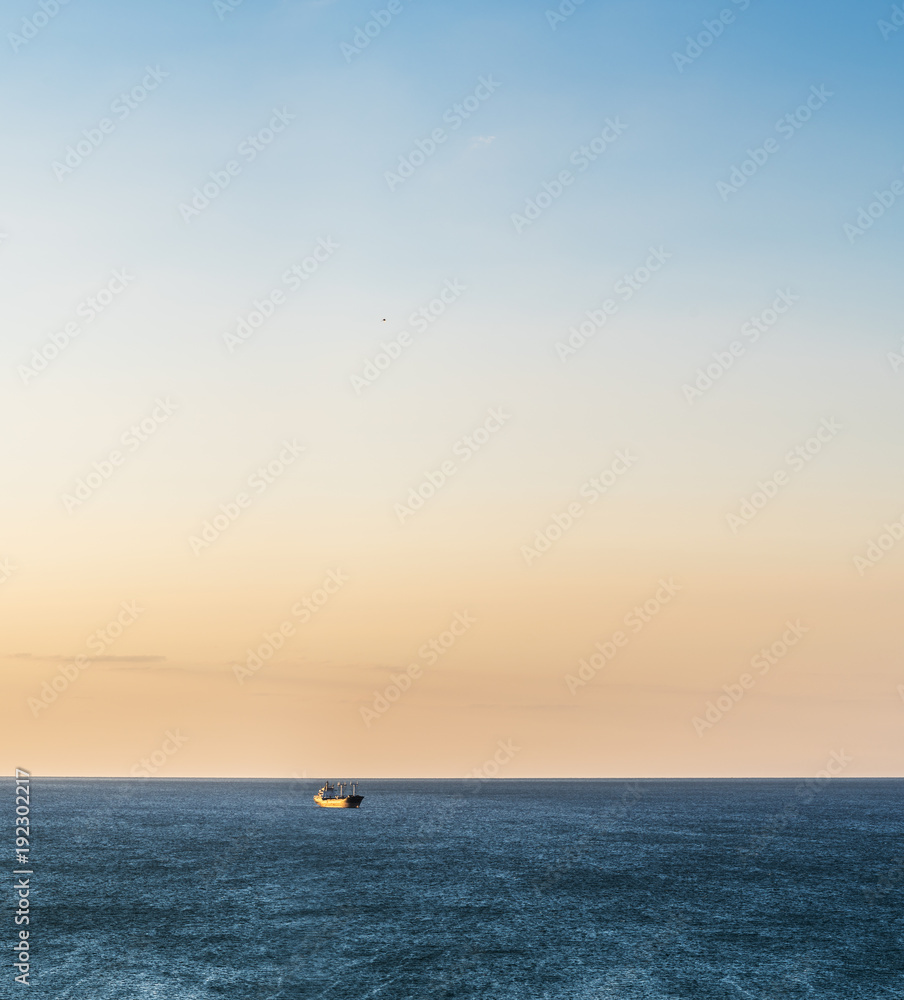 Calm sea and cloudless orange evening sky. Calm sea and cloudless orange evening sky.