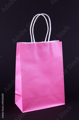 Pink shopping bag on black