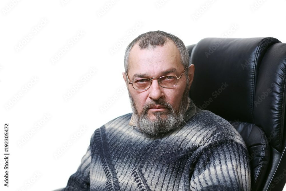 Fototapeta premium A man with a beard in a chair