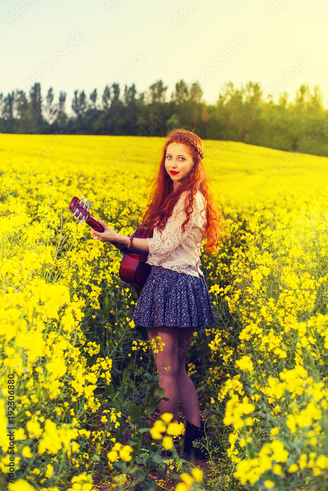 Young ginger hair girl in 70s style with acoustic guitar Young ginger hair girl in 70s style with acoustic guitar