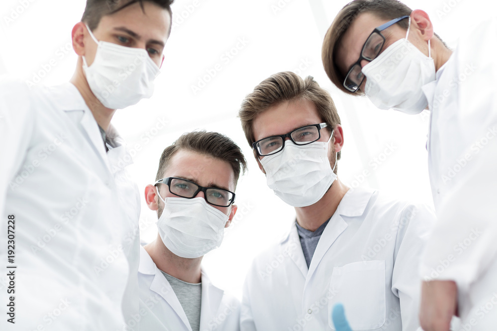 closeup.a serious group of doctors closeup.a serious group of doctors