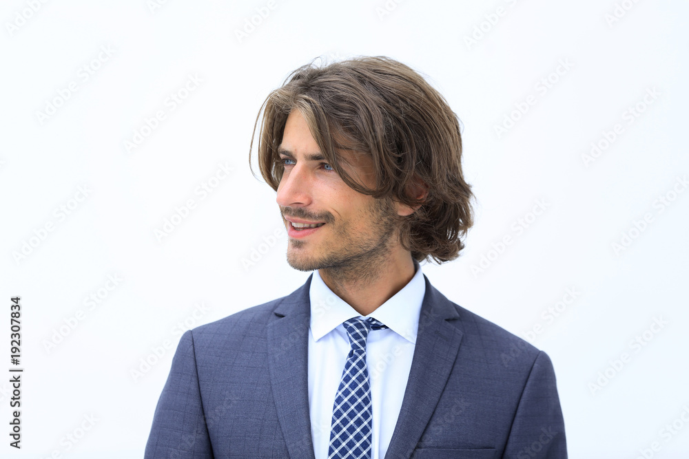 Handsome man in stylish clothes is looking away and smiling Handsome man in stylish clothes is looking away and smiling