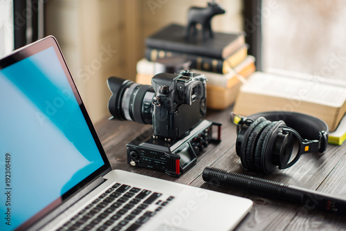 Audio / Video editing workspace office with mountain view. Photography and videography equipment.