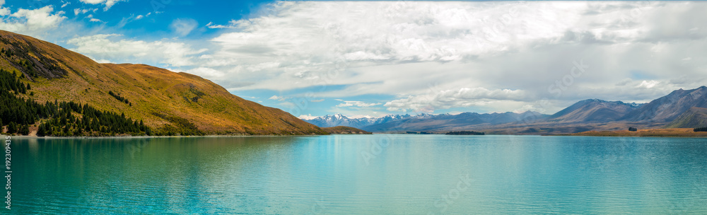 Panorama of Lake Tekapo with turquoise waters in New Zealand 