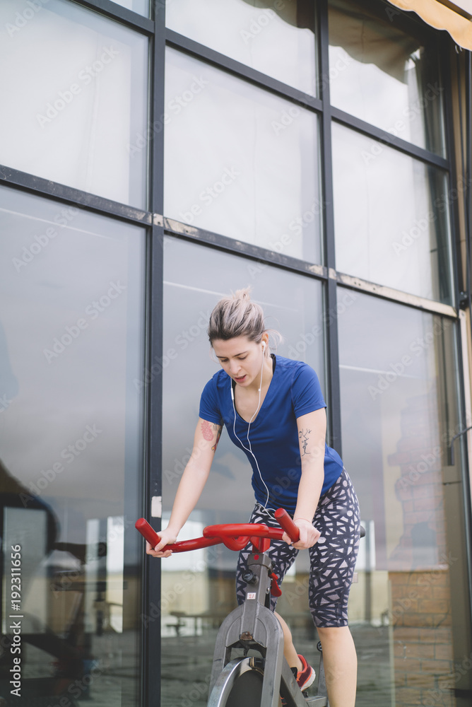 Woman practicing spinning at the gym